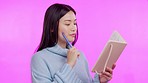 Asian woman, writing and idea with diary in studio for notes, planning or schedule by background. Japanese student, gen z girl and thinking with notebook, pencil or brainstorming with smile for study