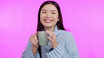 Coffee, funny and aroma with a happy asian woman in studio isolated on a pink background to relax. Smile, caffeine and drinking a beverage with a young female person enjoying a fresh cup of tea