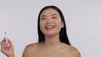 Asian woman, face and beauty, lipstick and happy in portrait, skin and makeup product on studio background. Cosmetology, dermatology and skincare, mockup space and female model apply cosmetic to lips