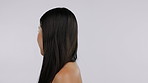 Hair, beauty and face with a model asian woman in studio on a white background for haircare or treatment. Portrait, skincare or cosmetics with a happy young female person at the salon or hairdresser