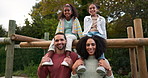 Happy family, relax and park in nature for holiday, weekend of fun bonding together in the outdoors. Portrait of Father, mother and children relaxing or enjoying time outside on piggyback in forest