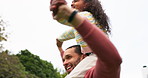 Happy, piggyback and smile with father and daughter in outdoors for bonding, playful and freedom. Family, happiness and game with man carrying young girl on shoulders for relax, support and love