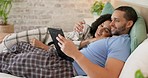 Couple, tablet and scroll in bed, morning and bond with internet video, movie and meme for love, care and hug. Man, woman and digital touchscreen for typing, social network app or web blog in house