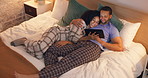 Couple, happy and hug in bedroom with tablet at night, streaming movie and relax. Smile, technology and man and woman in bed on social media app, watching online video and bonding together in home.