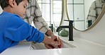 Woman, child and washing hands in bathroom, cleaning to prevent germs and dirt in home with soap, water and hygiene. Kid, mom and hand wash, teaching, learning and clean morning routine with family.