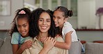 Love, happy and face of kids hugging their mom while relaxing on a sofa in the living room of a house. Bonding, happiness and girl children embracing their young mother with care in the family home.