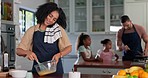 Phone call, time and woman baking at her house for a dinner, event or supper with her family. Late, mobile conversation and young female person checking the time while cooking in kitchen at home.