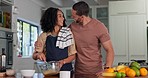 Happy couple cooking in kitchen with hug, love and care for quality time together at home. Young man embrace woman while preparing food for a lunch meal, dinner and romantic bonding in apartment