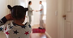 Back, parents arguing and girl in the hallway of her house, watching a fight, conflict or dispute. Kids, divorce or breakup with a young female child looking at her mother and father in an argument