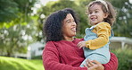 Family, children and a mother with her adopted daughter in the garden of their foster home together. Love, smile and kids with a stepmother holding her female child outdoor in the home backyard