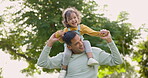 Happy, piggyback and father with girl in nature, bonding and having fun. Smile, dad and carrying child on shoulders, play and enjoying quality family time together outdoor in park with love and care.