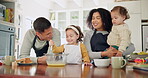 Family, children and girl is baking in kitchen for learning with food with happiness at house. Mixing, dessert and parents with girl for cooking with smile for preparing the ingredients together.