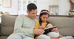 Father, tablet and relax with girl on sofa in home living room for bonding, learning on app or having fun. Dad, technology and happy child on couch, streaming movie or typing on social media together