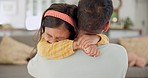 Love, support or dad hugging a girl to relax as a family in living room bonding in Mexico for childcare. Hug, affection or father with calm kid enjoying quality time on a holiday weekend at home 