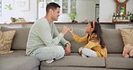 Father, daughter and pinky promise, bonding and trust, game and relax on sofa at home, spending quality time together. Man, young girl and playful, fun and connection with support and love in lounge