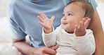 Young infant, clapping and bed with parents, care or learning with smile, love and childhood development. Baby kid, mom or dad in nursery, room and teaching applause with excited face in family house