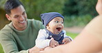 Family, love and parents playing with baby and outdoor bonding in a park to support infant in development or growth. Love, mother and father with happy kid and enjoying quality time in a park