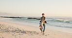 Father, spinning and son at beach for fun in summer for bonding or quality time with travel. Holiday, ocean and dad with spin and boy with energy, playful in outdoor for activity in weekend. 