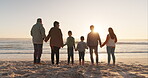 Family holding hands, ocean and beach with back view, grandparents and parents with children at sunrise and travel. Love, care and support, vacation and solidarity, women and men with kids outdoor