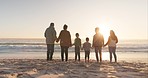 Family holding hands, ocean and sunshine with back view, grandparents and parents with children on the beach. Love, care and support, vacation and solidarity, women and men with boy kids outdoor