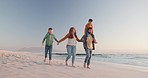 Holding hands, happy and family on a beach, walking and summer holiday with happiness, travel and getaway. Parents, mother and father with children, kids and seaside vacation with wellness and ocean