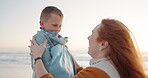 Beach, blanket and mother wrap child on a holiday or vacation to be warm and bonding feeling happy. Love, care and mom support kid on cold beach or sea for travel together enjoying quality time