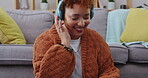 Phone, music headphones and happy woman in home for having fun, relax and smile. Mobile, listening and African person in lounge streaming radio, audio or podcast sound, hip hop or jazz in living room