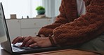 Closeup, remote work for home and woman with a laptop, typing and search internet with website information. Female person, business owner and entrepreneur with a pc, connection and online reading