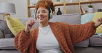 Dancing, music headphones and happy woman in home for having fun, energy and smile. Sound, listening and African person in lounge streaming radio, audio or podcast, hip hop or jazz in living room.