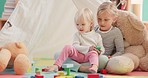 Kids, toys and bonding together in home, love and playing game for sisters in play room. Support, relationship development and girl child with baby on floor, teaching and learning with block puzzle.