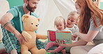 Family, reading and story for learning with children on floor for education and bonding. Kid, girls and parents are teaching with book for support with at house for fun with love and help or growth.