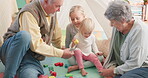 Happy, playing and grandparents with children and a toy for bonding, babysitting or care together. Smile, help and a senior man and woman with little kids with blocks for a game on living room floor