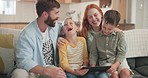 Parents, children and laughing on tablet in home for online games, reading funny story and comedy of meme. Mom, dad and kids streaming silly cartoon on digital technology, media and family in lounge