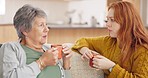 Home, mother and daughter with coffee, talking and bonding with communication, love and relax. Mama, senior woman and adult child with female person, tea and conversation with cappuccino in a lounge