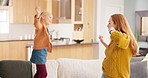 Mother, girl child and dancing in home with energy, fun and bonding for quality time together. Happy mom, young kid and jump on couch for dance celebration, play and excited for music in living room