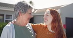 Senior mom, daughter and hug on street, greeting and talking with care, love and smile in summer. Elderly mother, adult child or woman with embrace, conversation and bonding in backyard at house