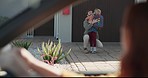 Father, welcome kid and home with backpack in driveway, sidewalk and hug with care, love and excited. Happy dad, young daughter and kindness with embrace, school bag and together at family house