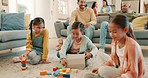 Family, home and children play with toys for bonding, quality time and child development. Parents, siblings and happy kids learning with tablet, building blocks and relax in living room on playdate