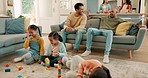 Family, living room and children play with toys for bonding, quality time and child development. Parents, siblings and happy kids learning with games, building blocks and relax on playdate at home