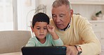 Grandfather, tablet or child elearning for education, growth development or knowledge in online class at home. Kid, virtual or kindergarten boy student in assessment test or studying in online class