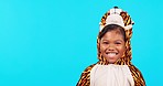 Tiger costume, laughing and face of girl in studio isolated on a blue background mockup space. Portrait, funny and happy child with comedy, humor and smile for positive mindset in animal cosplay.