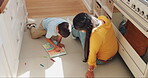 Education, drawing and mother with child on floor for teaching, studying and knowledge. Learning, art and mom with creative kid for homeschool, homework and development, bonding and care in kitchen.