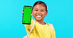 Happy little girl, phone and mockup for social media advertising against a blue studio background. Portrait of female child smile with mobile smartphone app, tracking markers and chromakey display