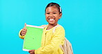 Happy girl, thumbs up and tablet on mockup for social media against a blue studio background. Portrait of little child or kid smile with like emoji, yes sign or approval for technology app or success