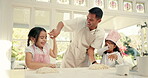 Baking, dough and a father teaching his girls about cooking in the kitchen of their home together. Pastry, children or family with kids learning about food from from a man parent in the house