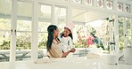 Dance, happy and mom baking with her child in the kitchen while preparing a meal, supper or dinner. Happiness, fun and young mother cooking, dancing and bonding with her girl kid at home together.