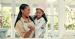 Sing, dance and mother baking with her kid in the kitchen while preparing a meal, supper or dinner. Happy, smile and young mom cooking, bonding and dancing to music with her girl child at their home.