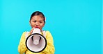 Megaphone, news and face of girl child in studio with message, broadcast or speech on blue background. Speaker, noise and portrait of kid with bullhorn for announcement of sale, deal or promotion