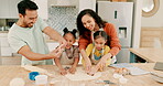 Instructions, dough and a family baking in the kitchen together with parents teaching their girl children about food. Cookie, shape or bonding with kids learning how to cook from a mother and father