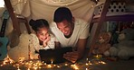 Tent, father and girl on tablet at night watching movies, online games and cartoon with fairy lights. Happy family, blanket and dad with child in bedroom on digital tech for bonding, relax and love